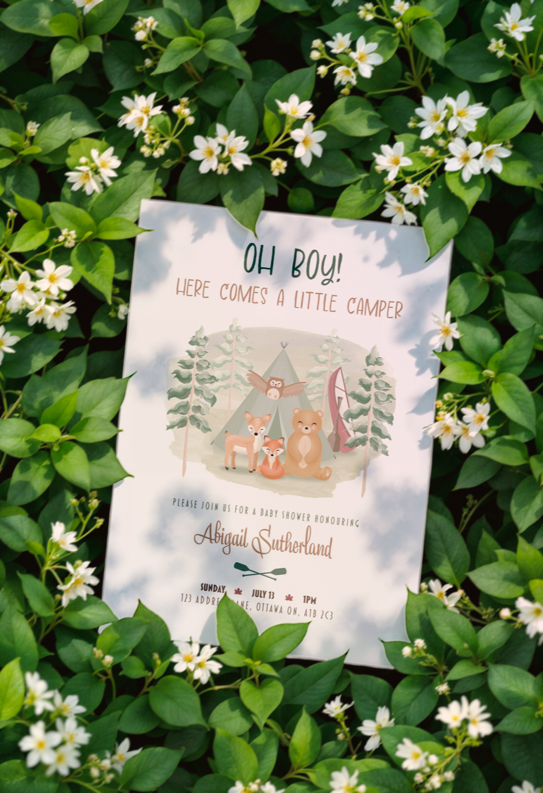 A mockup image of the invitation with woodland creatures and the event details.