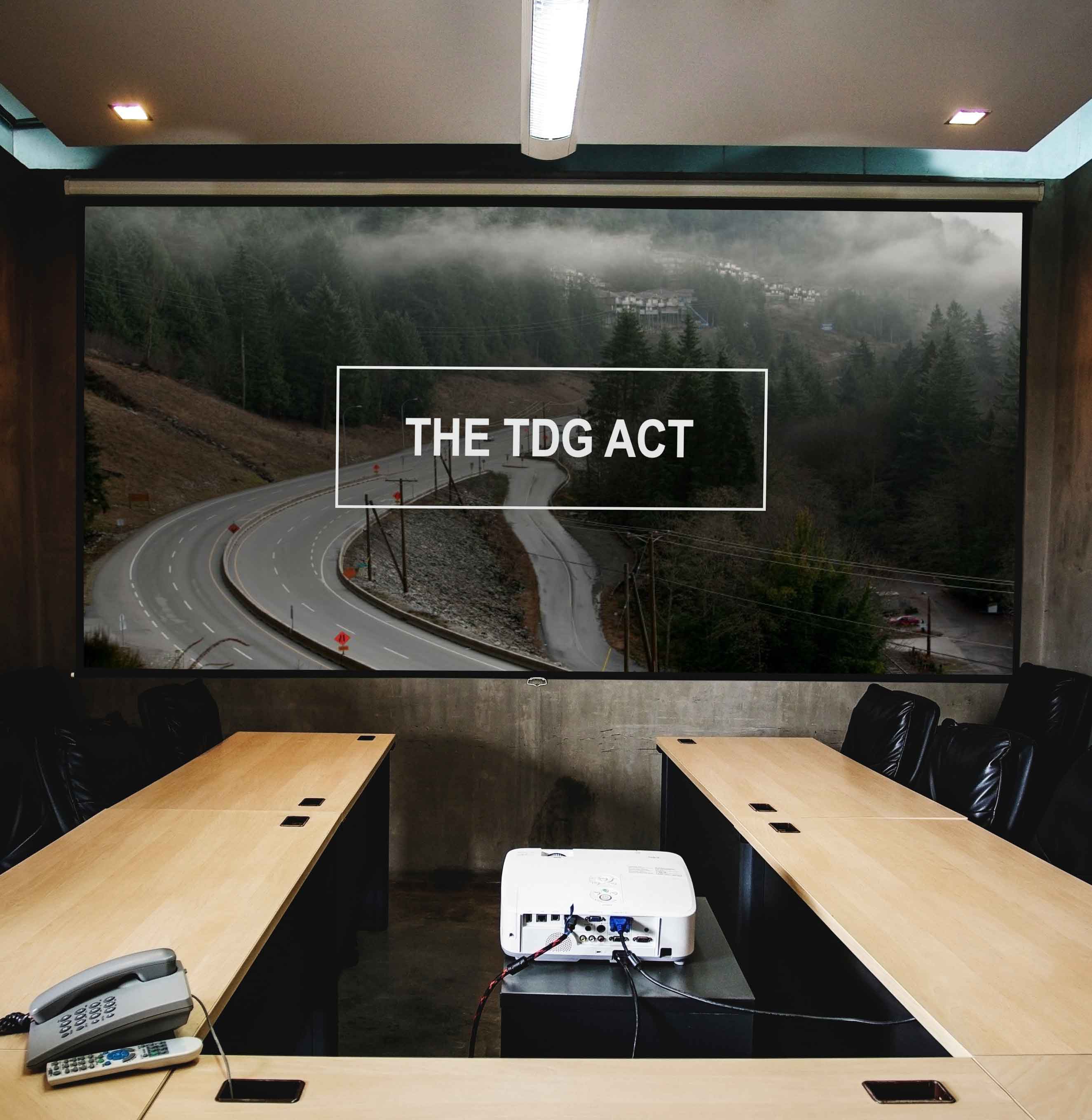 A mockup of the powerpoint projected on a screen in an office setting.